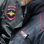 полицейские в форме, видны плечи и погоны